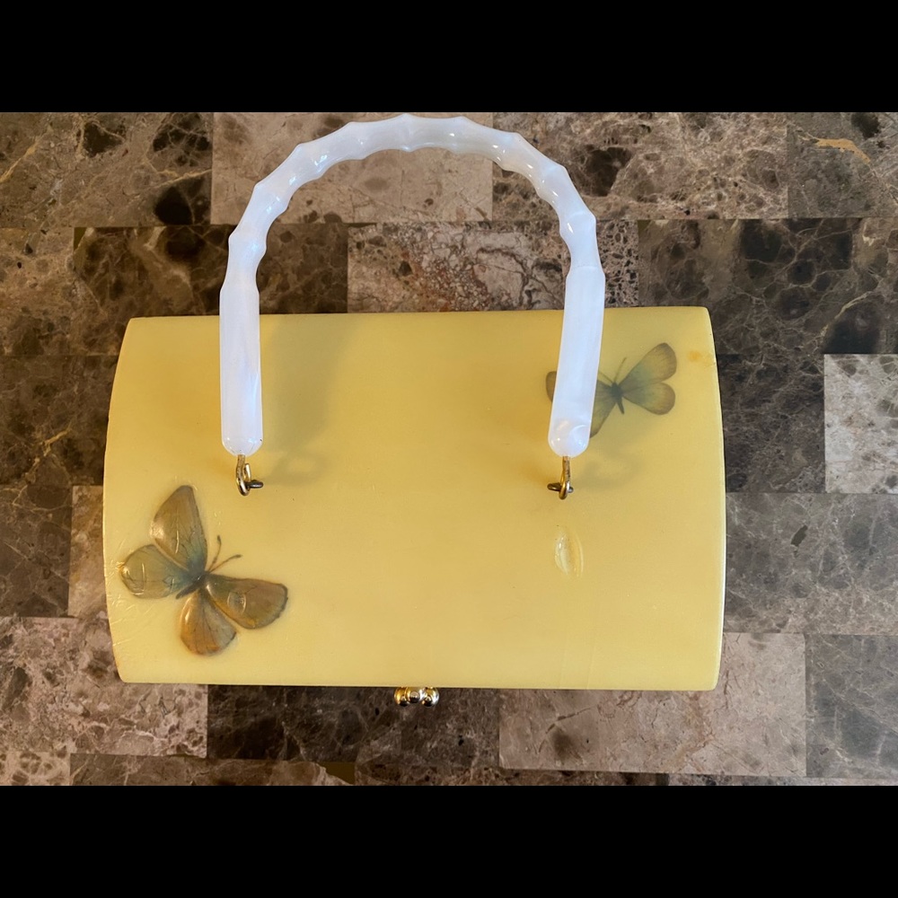 Very unique box purse.  Gold tone clasp.
